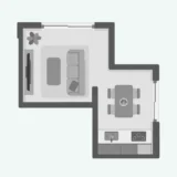 上から見たL字型LDKの平面図。ソファとテレビ、食卓とキッチンが描かれている。